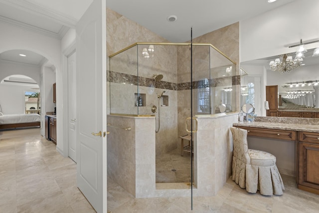 bathroom with crown molding, vanity, and an enclosed shower