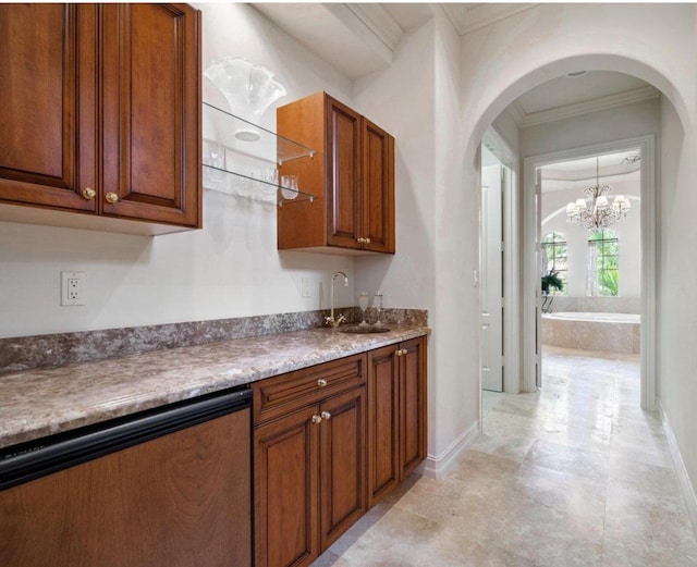 kitchen featuring ornamental molding and sink