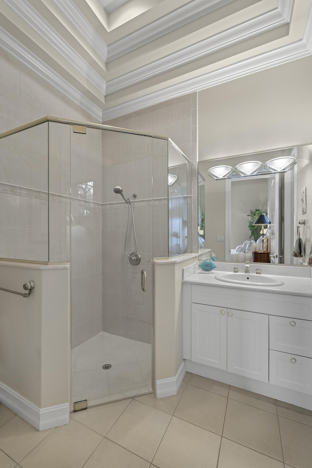 bathroom with vanity, a shower with shower door, ornamental molding, and tile patterned flooring