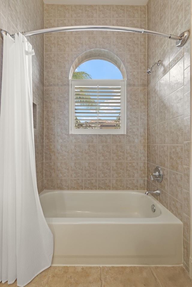 bathroom featuring tile patterned floors and shower / bath combination with curtain