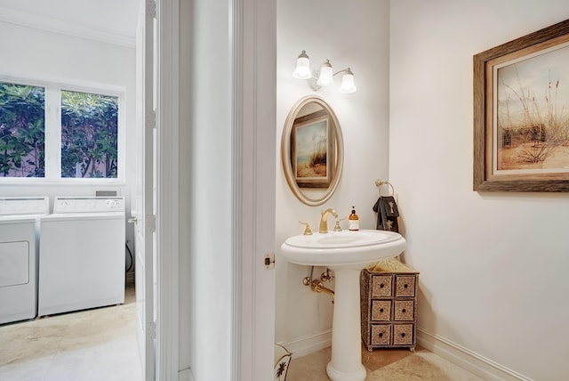 bathroom featuring sink and separate washer and dryer