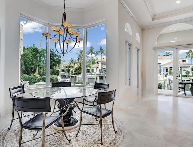 dining space with a chandelier and crown molding