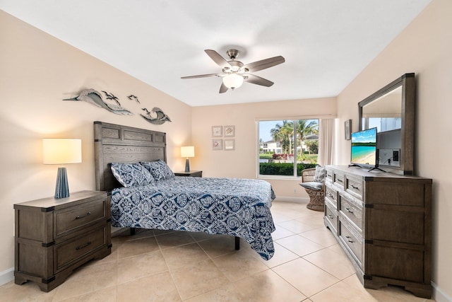 tiled bedroom with ceiling fan