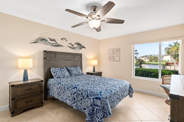 bedroom with light tile floors and ceiling fan