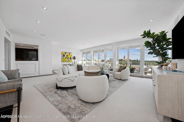 living room with light colored carpet