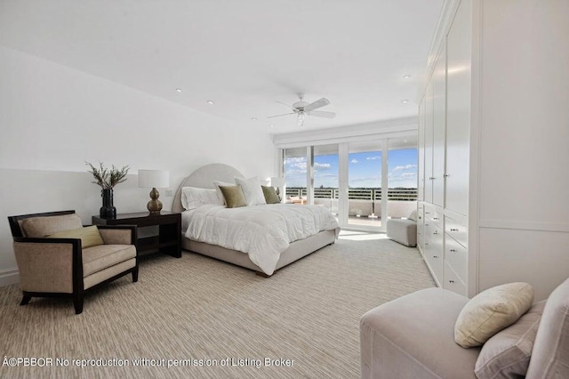 bedroom featuring light colored carpet, ceiling fan, and access to exterior