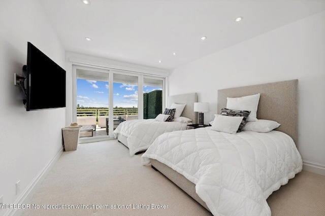 bedroom featuring light carpet and access to exterior