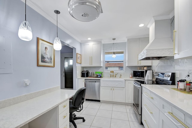 kitchen featuring white cabinetry, premium range hood, and stainless steel appliances