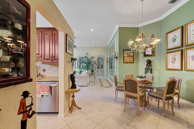 dining area with crown molding, light tile patterned floors, a notable chandelier, and a textured ceiling