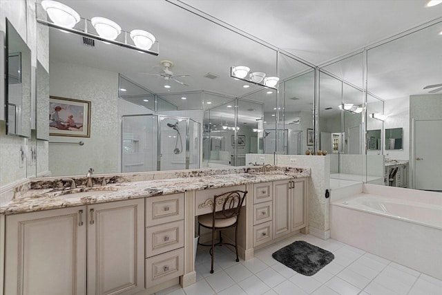 bathroom with a ceiling fan, a sink, a stall shower, double vanity, and tile patterned floors