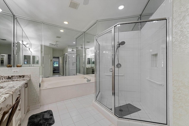 bathroom with a shower stall, vanity, visible vents, and a bath