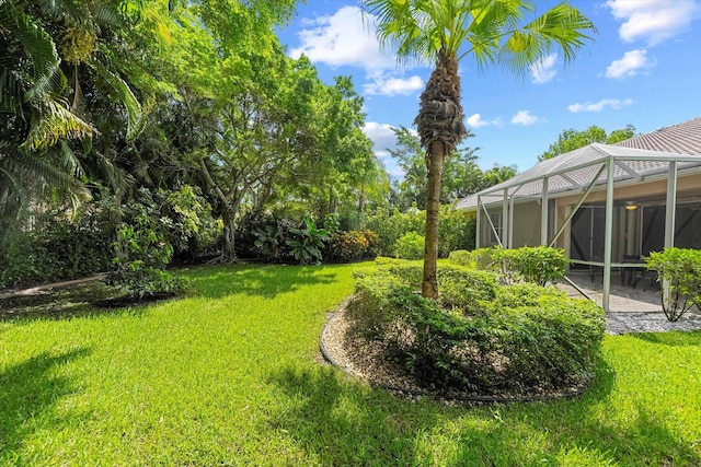 view of yard with a patio area and a lanai