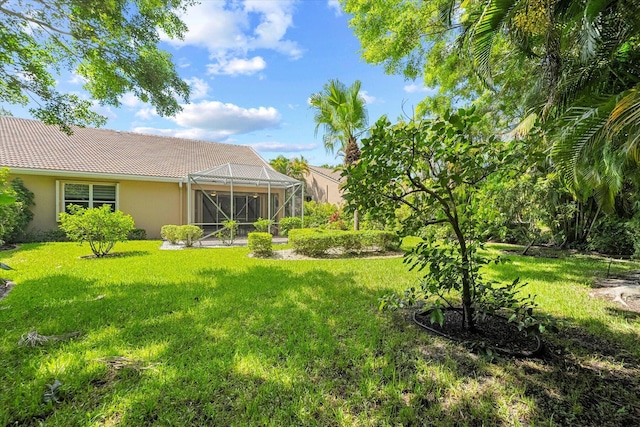 view of yard with a lanai