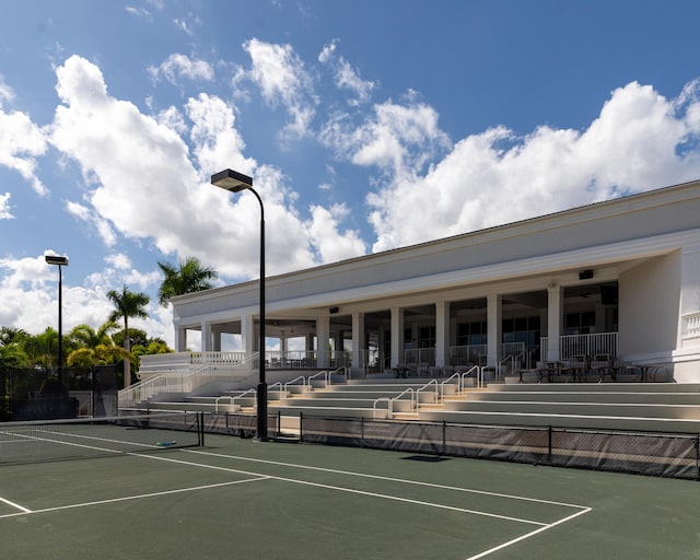 view of tennis court with fence
