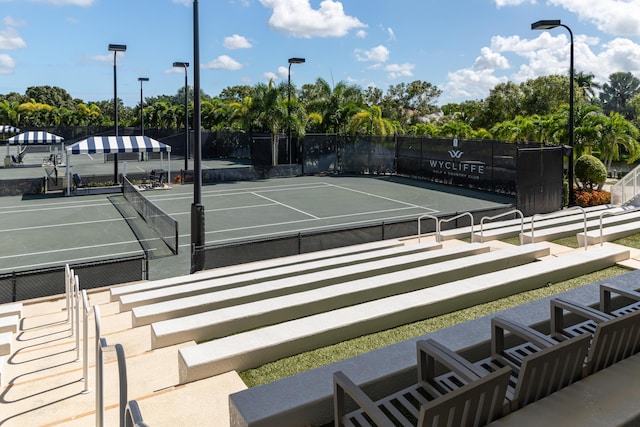 view of sport court featuring fence