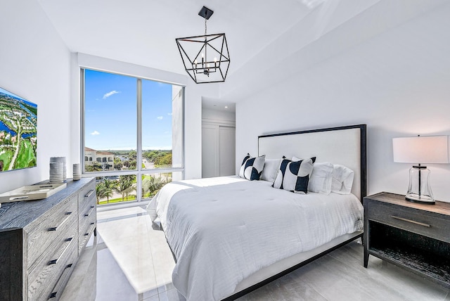 bedroom featuring a chandelier