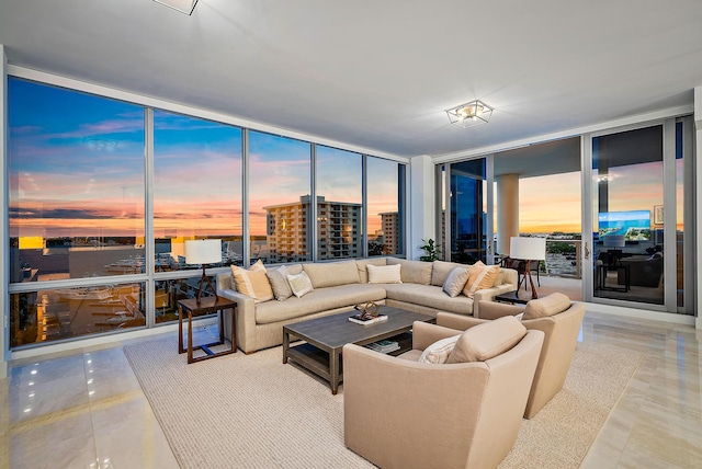 living room featuring floor to ceiling windows