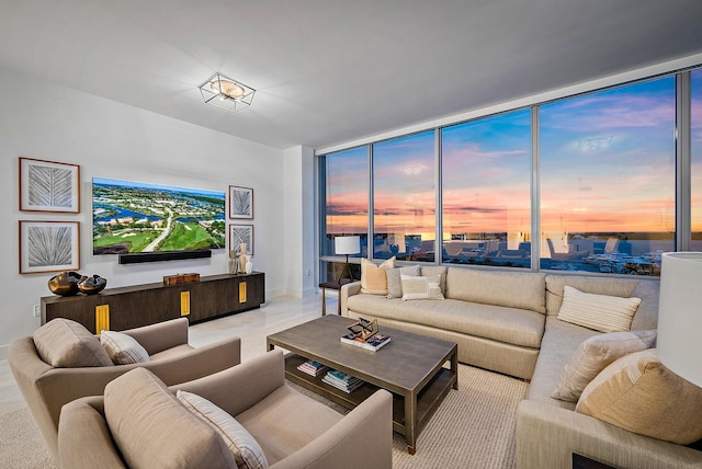 living room featuring floor to ceiling windows