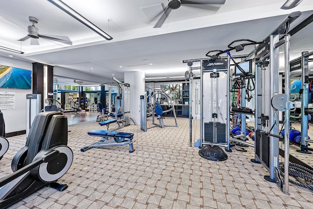 exercise room with ceiling fan and light carpet