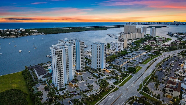 aerial view at dusk with a water view