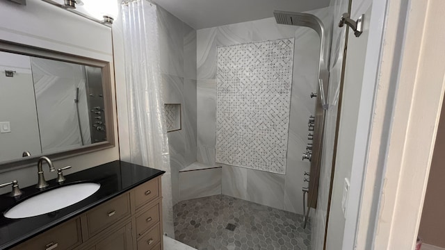 bathroom featuring vanity and curtained shower