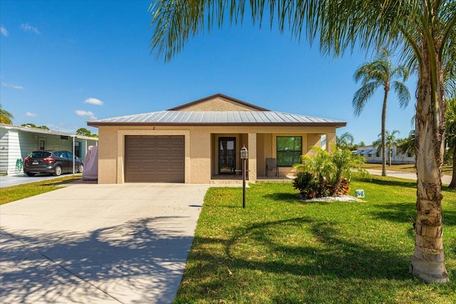 view of front of house featuring a front yard and a garage