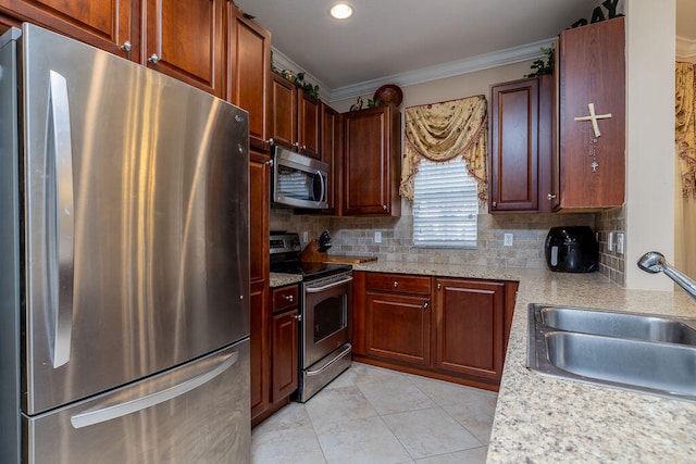 kitchen with sink, appliances with stainless steel finishes, tasteful backsplash, and light tile floors