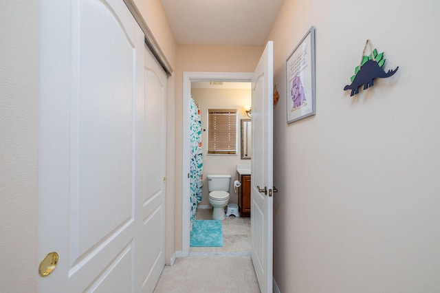 corridor featuring light tile floors