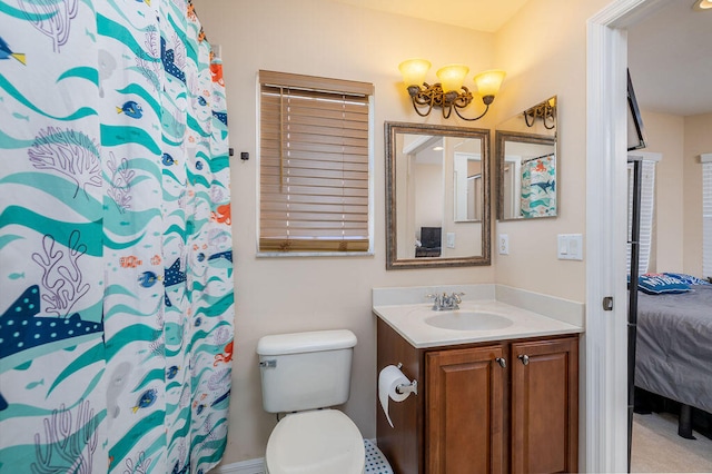 bathroom with toilet and oversized vanity