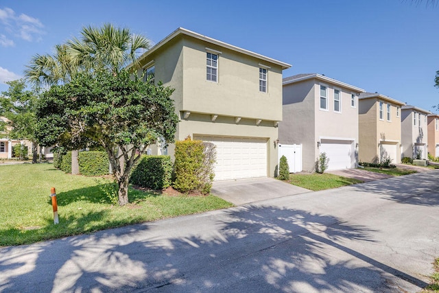 view of front facade featuring a front yard and a garage