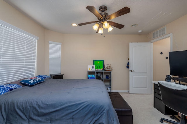 carpeted bedroom featuring ceiling fan