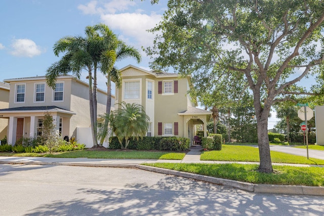 view of front of home with a front lawn