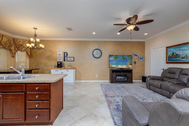 tiled living room featuring ceiling fan with notable chandelier, sink, and crown molding