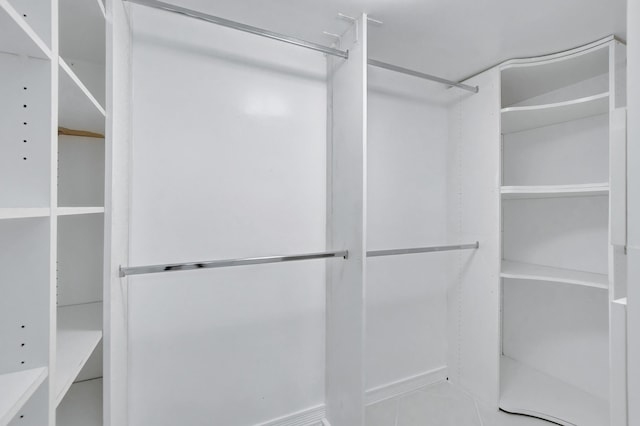 spacious closet featuring tile floors