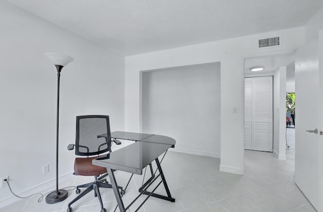 home office with light tile flooring