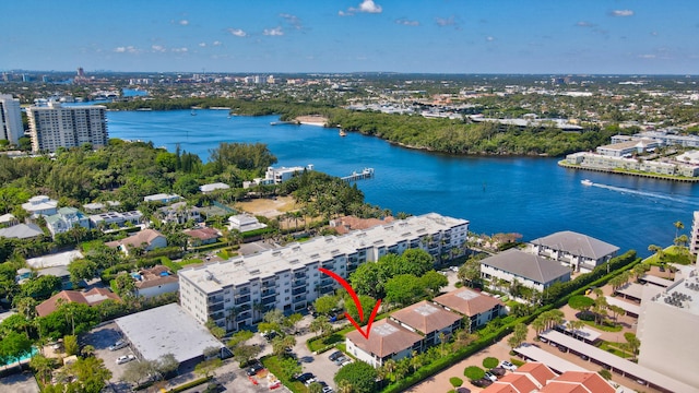 birds eye view of property with a water view