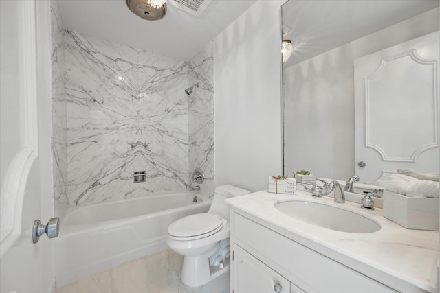 full bathroom featuring vanity, tiled shower / bath combo, and toilet