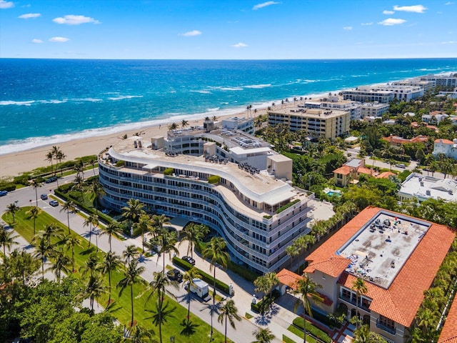 aerial view with a water view and a view of the beach