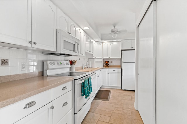 kitchen with tasteful backsplash, white cabinetry, ceiling fan, and white appliances