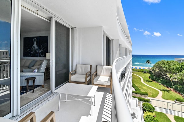 balcony featuring a water view