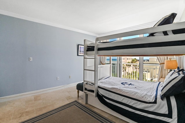 bedroom featuring ornamental molding and access to exterior