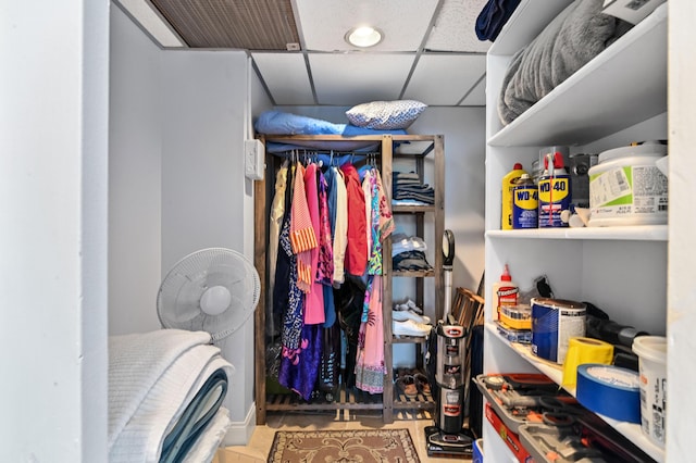 walk in closet featuring a drop ceiling