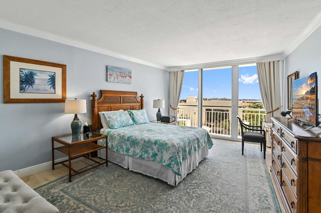 bedroom with a wall of windows, ornamental molding, access to exterior, and a textured ceiling