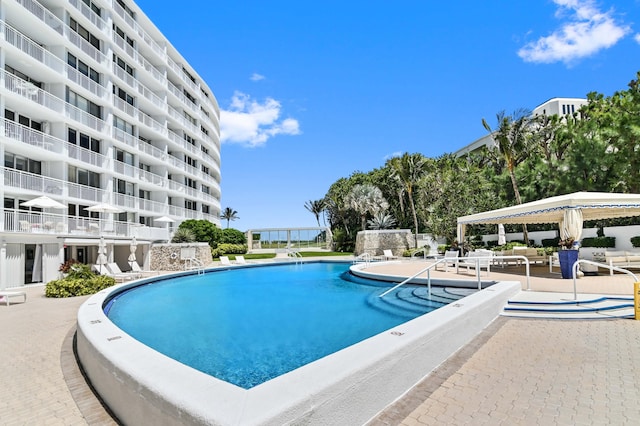 view of pool featuring a patio