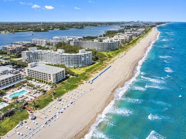 bird's eye view featuring a water view and a view of the beach