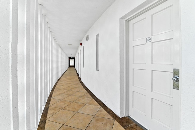 corridor featuring tile patterned flooring