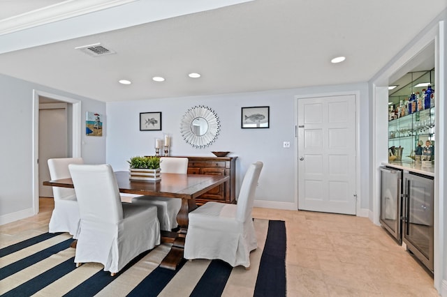 dining room featuring wine cooler and bar area