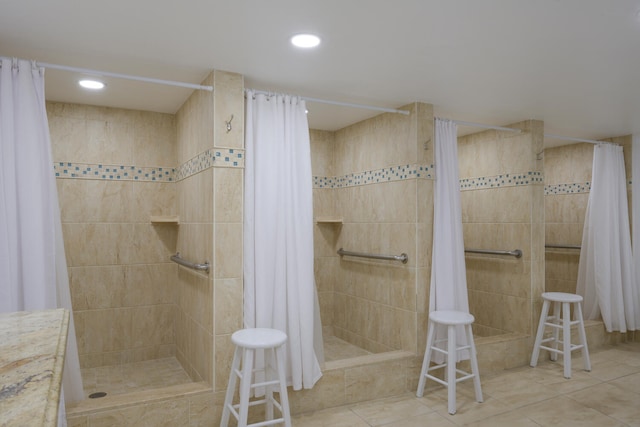 bathroom featuring walk in shower and tile floors