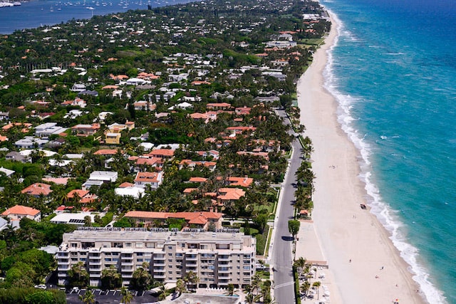 bird's eye view featuring a water view and a beach view