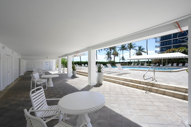 view of terrace with a community pool